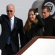 Vice President Joe Biden waves as he walks out of Air Force Two with his granddaughter Finnegan Biden and son Hunter Biden at the airport in Beijing Dec. 4, 2013.
Ng Han Guan-Pool/Getty Images